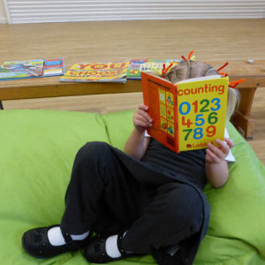 Comfy spaces and a range of books provide for a bit of quiet reading-time.