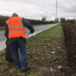 Community Plan Litter Pick volunteer tackles litter along the A57 Hollins Green - February 2019