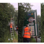 Community Plan volunteer cleans the Warburton Bridge sign - action day 1st June 2019.