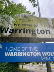 WBC sign on A57 before cutting back foliage and cleaning - June 2025